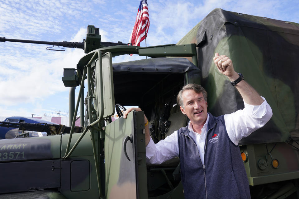 Republican gubernatorial candidate Glenn Youngkin gives a thumbs up after getting out of an army truck at a airshow in Fredericksburg, Va., Saturday, Oct. 30, 2021. Youngkin will face Democrat former Gov. Terry McAuliffe in the November election. (AP Photo/Steve Helber)