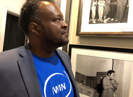 Lakethen Mason, a Memphis Democrat, studies photographs from the Civil Rights era at a summit on African-American engagement summit he organized at MemphisÕ Withers Collection Museum and Gallery in Memphis, Tennessee, U.S., October 5, 2018. REUTERS/Sharon Bernstein