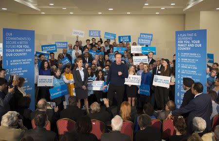 Britain's Prime Minister and Conservative political party leader David Cameron (C) delivers a speech to supporters in north London March 7, 2015. REUTERS/Neil Hall