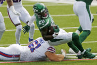 New York Jets running back Le'Veon Bell (26) is brought down by Buffalo Bills' Justin Zimmer (61) during the first half of an NFL football game in Orchard Park, N.Y., Sunday, Sept. 13, 2020. (AP Photo/John Munson)