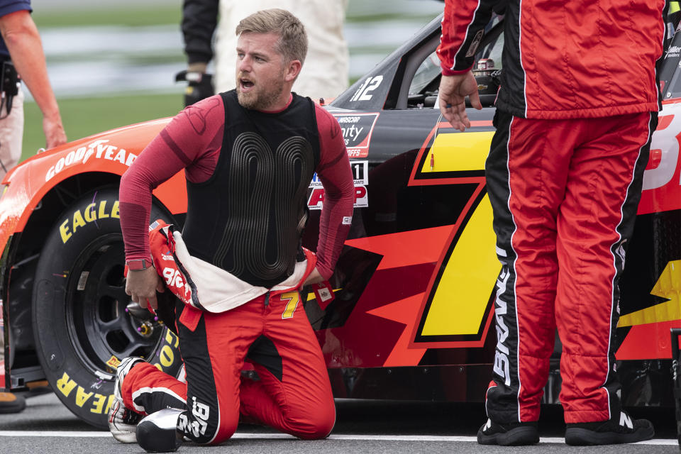 NASCAR Xfinity Series driver Justin Allgaier (7) adjusts his race suit prior to the NASCAR Xfinity auto race at the Charlotte Motor Speedway Saturday, Oct. 9, 2021, in Concord, N.C. (AP Photo/Matt Kelley)