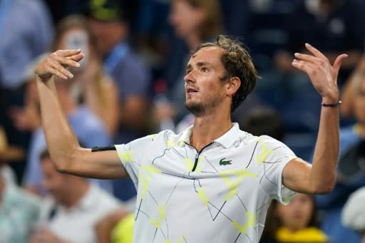 Russia's Daniil Medvedev encourages a booing crowd after defeating Germany's Dominik Koepfer on Sunday at the US Open