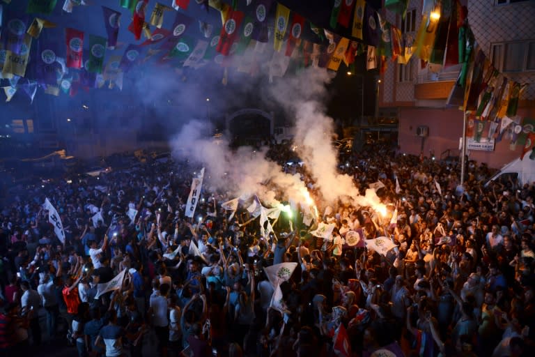 Supporters of the pro-Kurdish Peoples' Democratic Party (HDP) celebrate in the streets of Diyarbakir after the party picked up 67 seats in the parliamentary vote