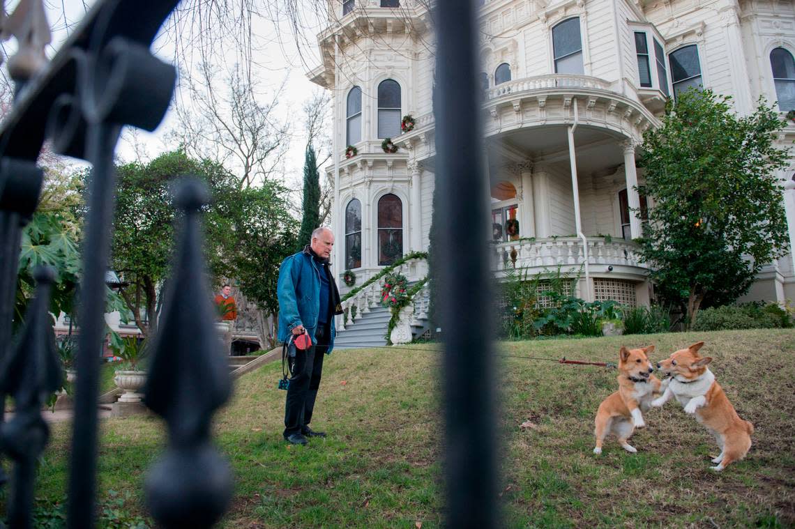 Then-Gov. Jerry Brown watches corgis Sutter and Colusa play in front of the Governor’s Mansion in 2015. Brown, who also lived in the mansion during his father’s time as governor, was the first governor to live in the Mansion Flats landmark after Gov. Ronald Reagan abandoned it in the 1960s.