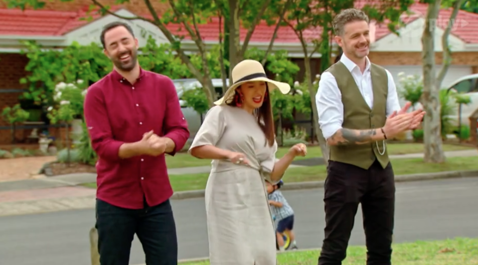 Small boy rides past on road behind MasterChef judges