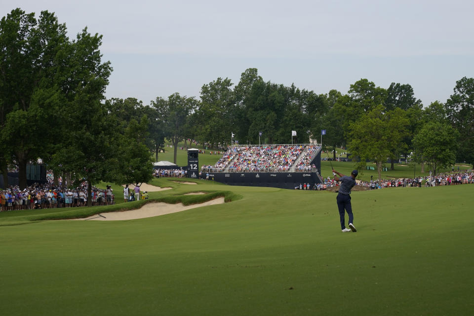 Tiger Woods hits from the fairway on the 12th hole during the first round of the PGA Championship golf tournament, Thursday, May 19, 2022, in Tulsa, Okla. (AP Photo/Matt York)