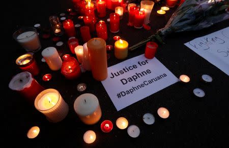 Candles are seen during a candlelight vigil in memory of Malta's journalist Daphne Caruana Galizia in Brussels, Belgium, October 18, 2017. REUTERS/Yves Herman