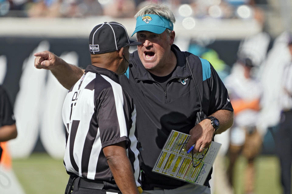 Jacksonville Jaguars head coach Doug Pederson talks to down judge Patrick Turner during the second half of an NFL football game against the New York Giants Sunday, Oct. 23, 2022, in Jacksonville, Fla. (AP Photo/John Raoux)