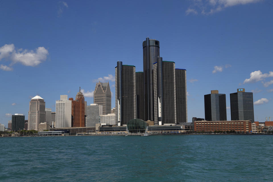 In this May 12, 2020 photo, the Detroit skyline is shown from the Detroit River. Michigan's slow population growth over the past decade will cost the state a U.S. House seat, continuing a decades-long trend as job-seekers and retirees have fled to other states. (AP Photo/Paul Sancya)