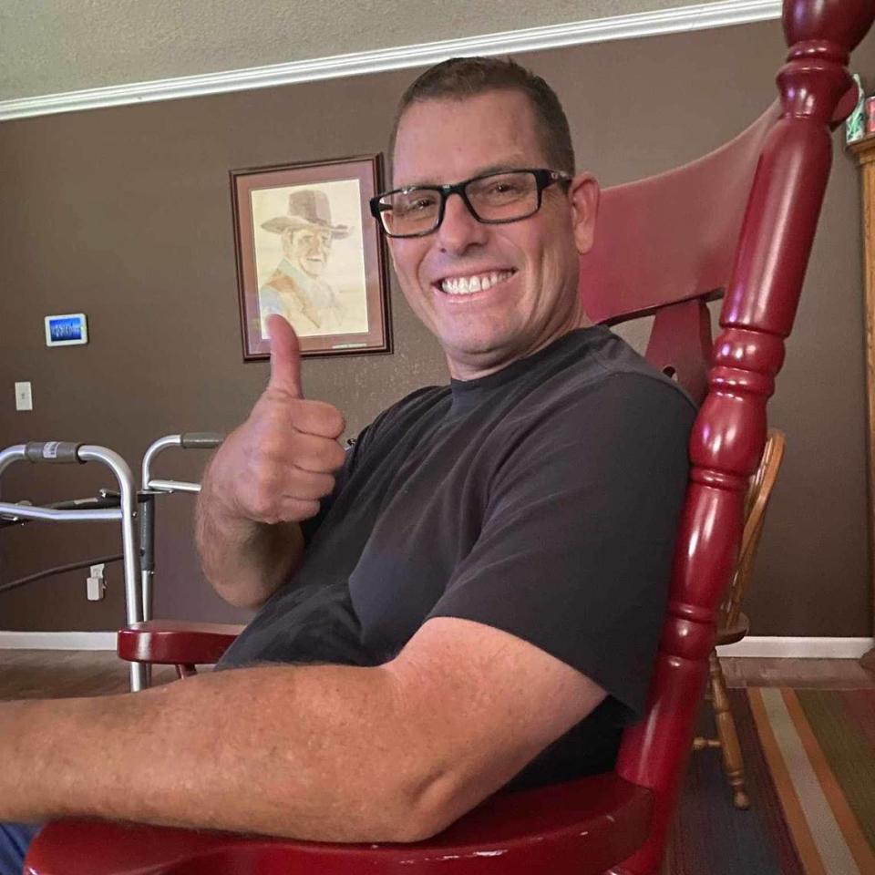 Strathmore High football coach Jeromy Blackwell gives a thumbs up after recovering from a fall that put him in a medically-induced coma in late June, 2023.