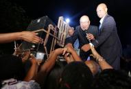 Suriname's President Desi Bouterse, who was convicted of murder for the execution of opponents by a court in Suriname, addresses supporters after arriving from China, in Paramaribo