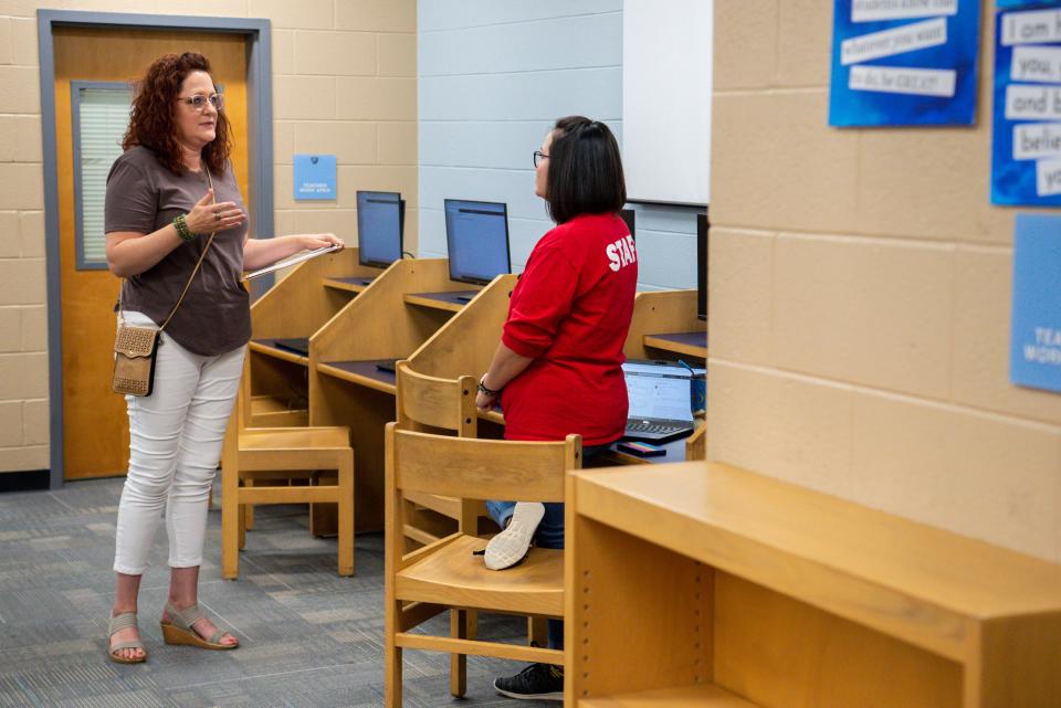 Job candidate Schelle Cooley of Nashville talks with Katie Wells of Williamson County Schools Human Resources during a job fair for open classified positions in the school district on Friday, July 23, 2021 held at Centennial High School in Franklin, Tenn.