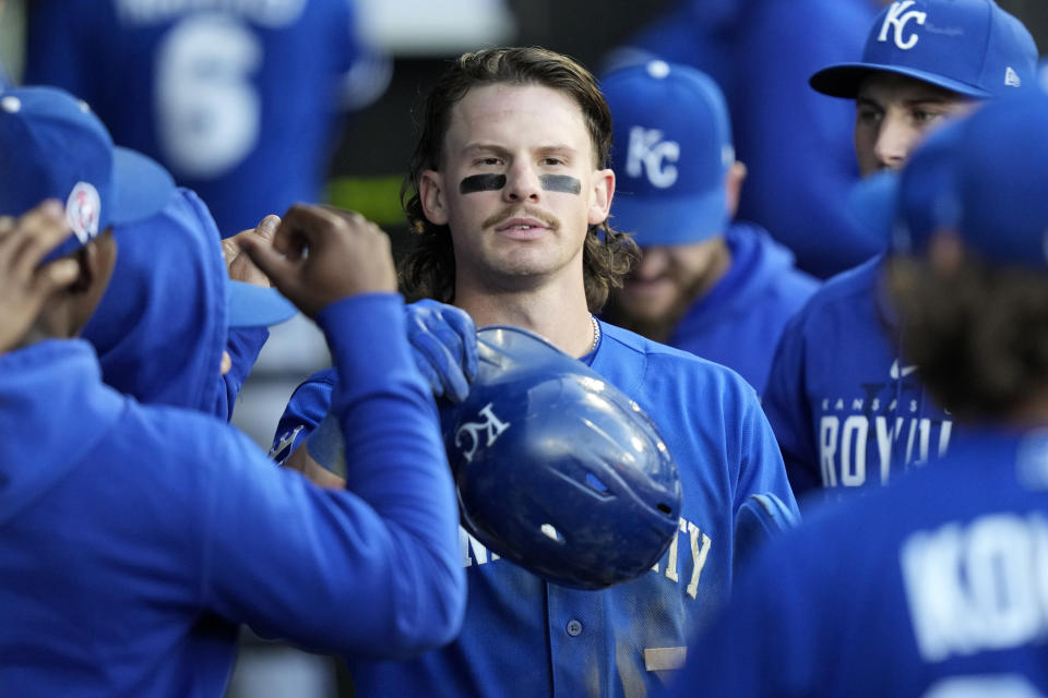 Kansas City Royals' Bobby Witt Jr. is greeted in the dugout after scoring on Edward Olivares' single off Chicago White Sox relief pitcher Lane Ramsey during the eighth inning in the first baseball game of a doubleheader, Tuesday, Sept. 12, 2023, in Chicago. (AP Photo/Charles Rex Arbogast)