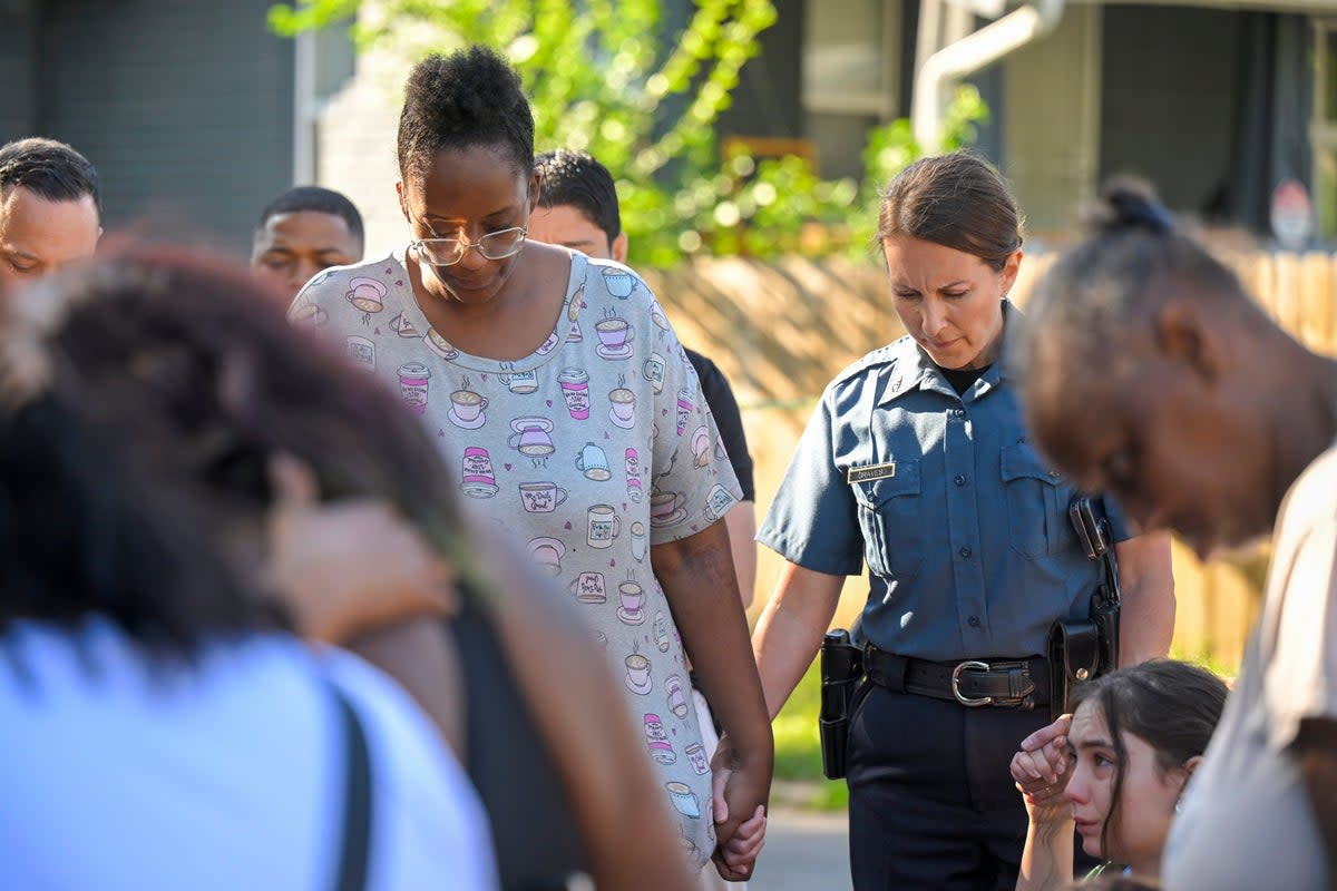 Kansas City Police Department chief Stavey Graves visits the scene of a mass shooting that left three people dead and injured five others on 25 June (AP)