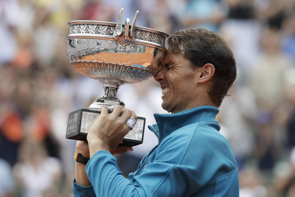 FILE - Spain's Rafael Nadal lifts the trophy as he celebrates winning the men's final match of the French Open tennis tournament against Austria's Dominic Thiem at Roland Garros stadium in Paris, France, Sunday, June 10, 2018. (AP Photo/Alessandra Tarantino, File)