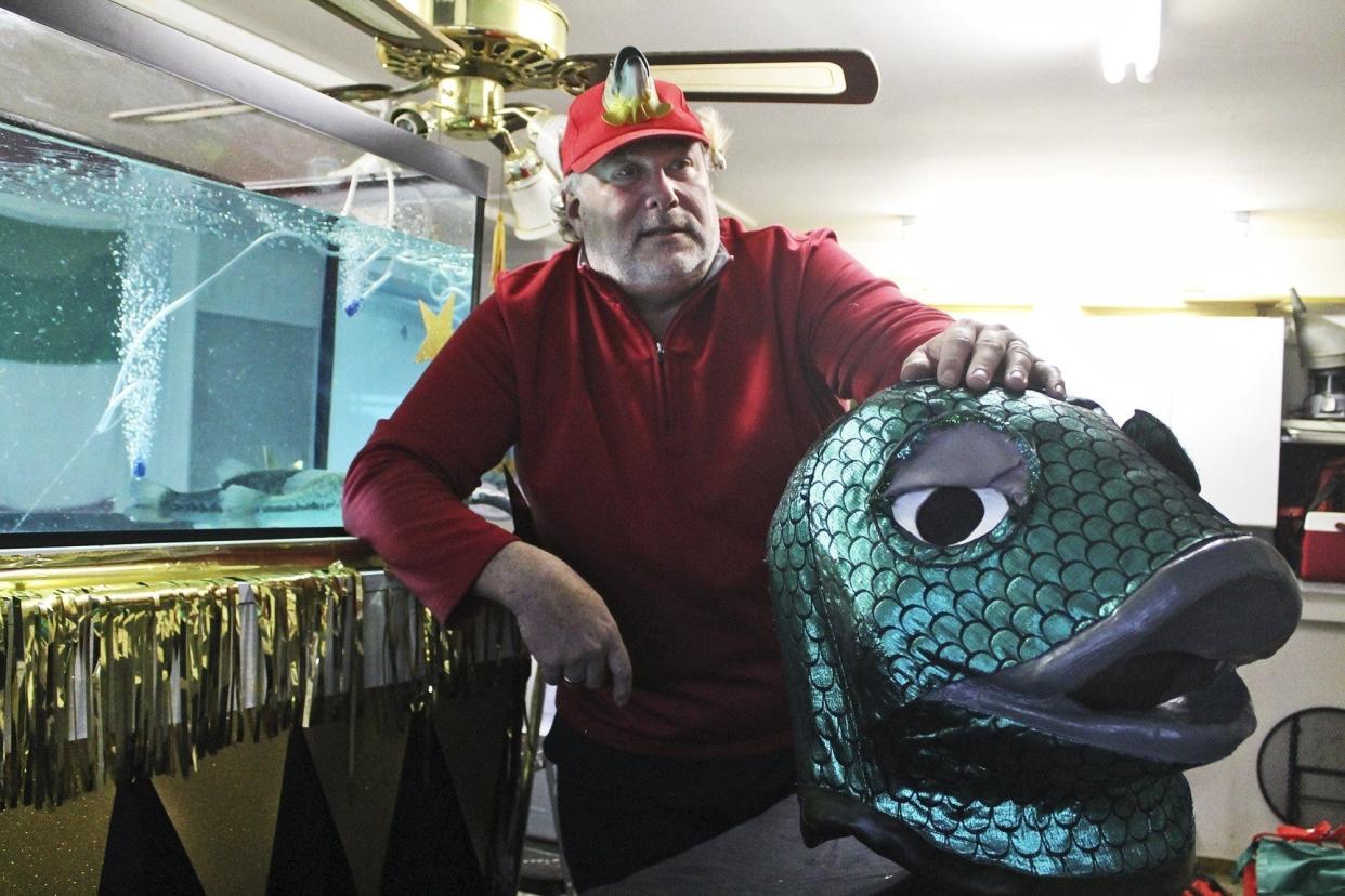 Mike Fornataro in 2019, chairman of the Buckeye Lake Winterfest, stands in front of the tank holding Benny the Bass, who will predict Saturday morning whether the area will have an early spring.