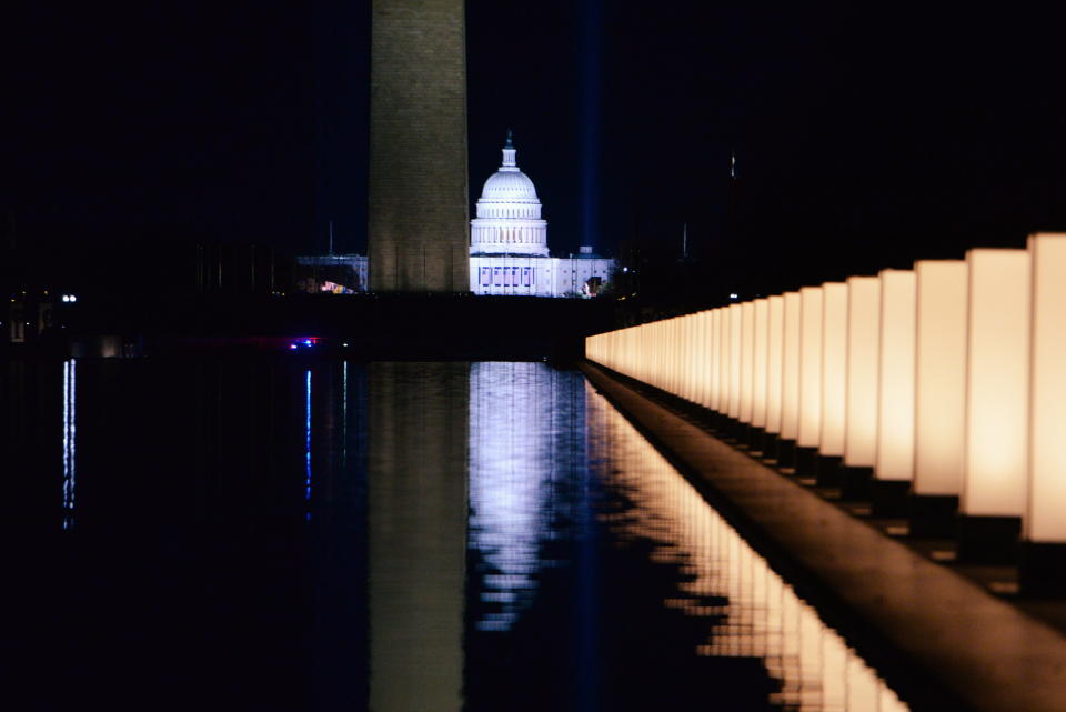 The memorial took place on the eve of Inauguration Day, which will look dramatically different from any other due to the pandemic and intense security measures after an insurrection at the U.S. Capitol on Jan. 6. (Photo: Callaghan O'Hare/Reuters)