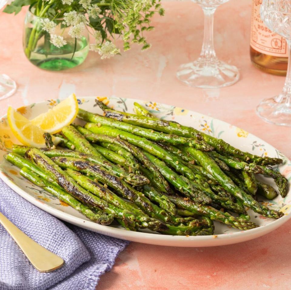 sauteed asparagus with lemon wedges