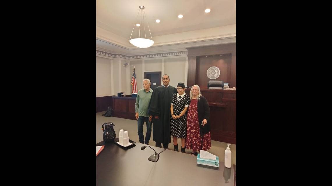 Melissa Highsmith was accompanied by family including her father, Jeffrie Highsmith (far left), and her mother, Alta Apantenco (far right), as she officially changed her name back on Wednesday, May 17. 