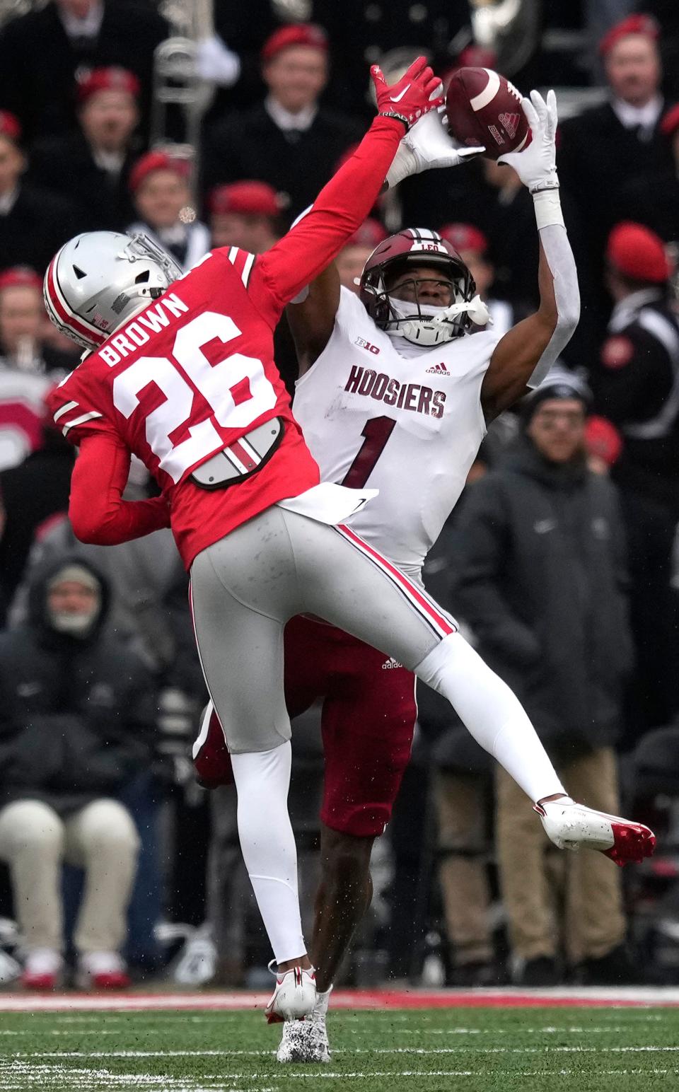 Indiana's Devon Matthews is defended by Ohio State cornerback Cameron Brown.