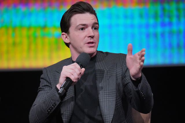 <p>Gonzalo Marroquin/Getty</p> Drake Bell speaking at the 'Quiet On Set: The Dark Side of Kids TV' For Your Consideration even