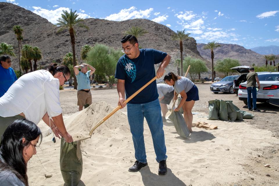 Ahead of widespread rain as Hurricane Hilary comes closer to the Coachella Valley, residents fill sandbags at the Rancho Mirage Library and Observatory in Rancho Mirage, Calif., on Friday, August 18, 2023.