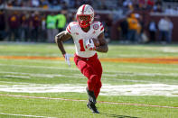 Nebraska running back Rahmir Johnson (14) rushes against Minnesota in the third quarter of an NCAA college football game, Saturday, Oct. 16, 2021, in Minneapolis. Minnesota won 30-23. (AP Photo/Bruce Kluckhohn)