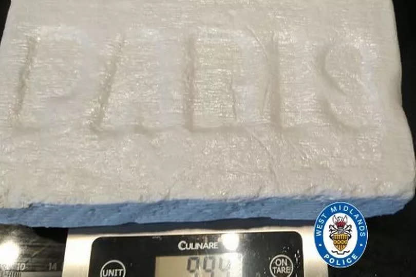 Kilo block of cocaine, stamped with the word 'Paris' -Credit:WMP