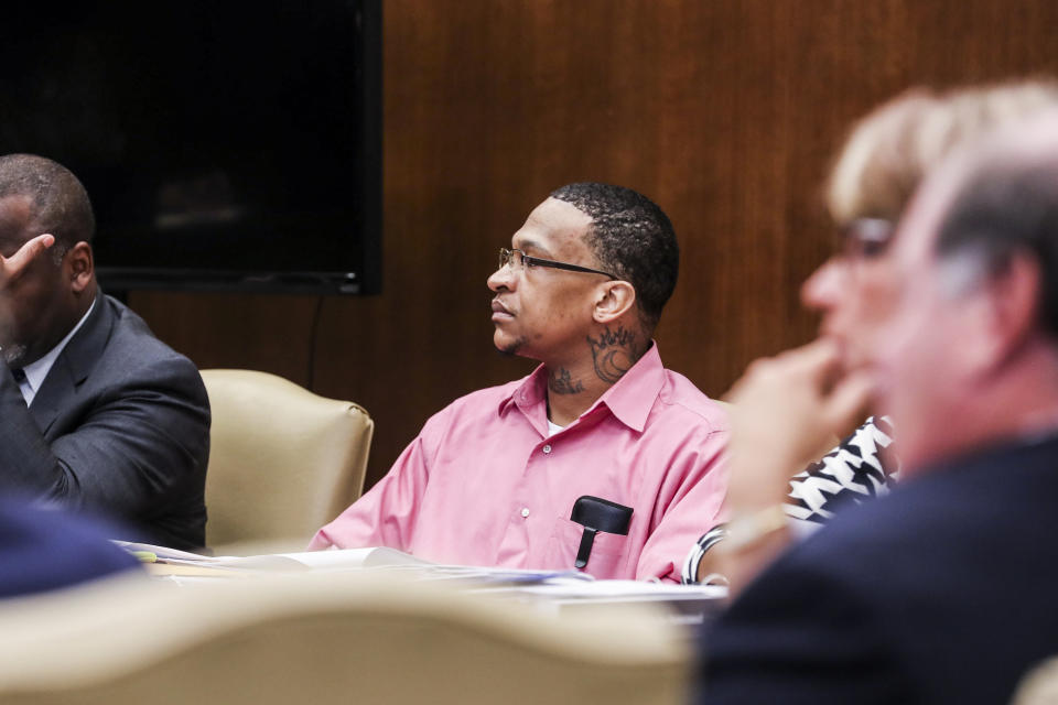 Quinton Tellis, right, is seen on the first day of his retrial in Batesville, Miss., Tuesday, Sept. 25 2018. Tellis is charged with burning 19-year-old Jessica Chambers to death almost three years ago on Dec. 6, 2014. Tellis has pleaded not guilty to the murder. (Brad Vest/The Commercial Appeal via AP, Pool)