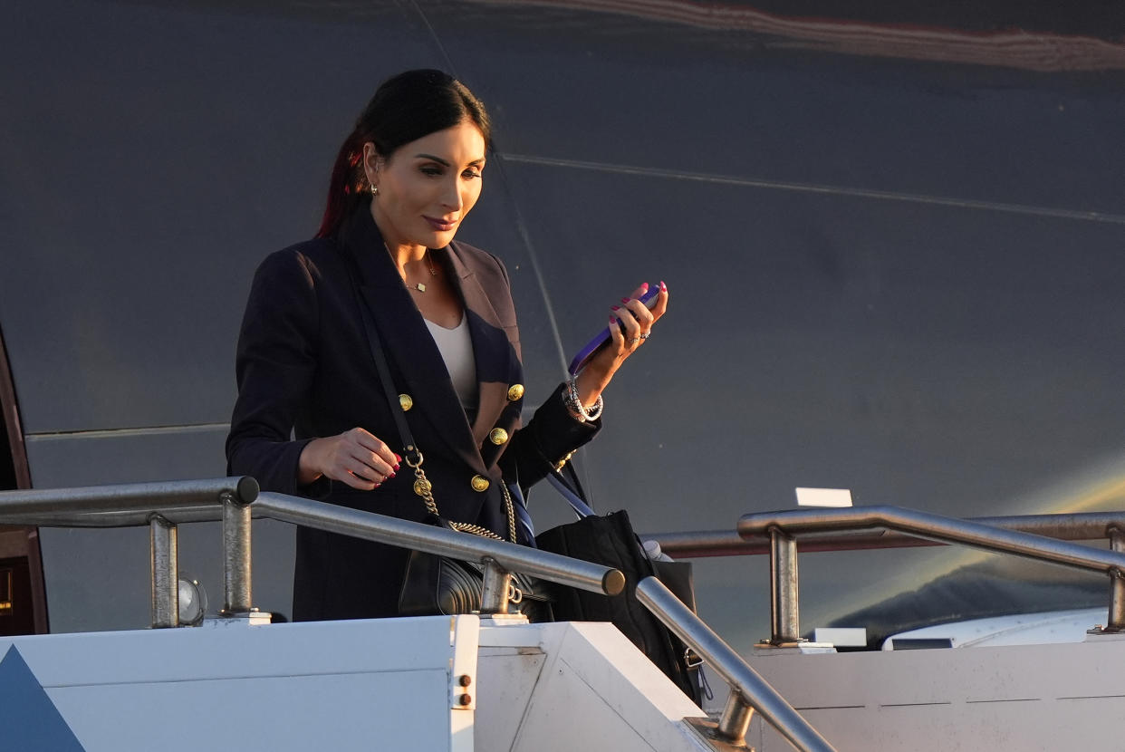 Laura Loomer arrives with Republican presidential nominee former President Donald Trump at Philadelphia International Airport, Tuesday, Sept. 10, 2024, in Philadelphia, for the presidential debate. (AP Photo/Chris Szagola)