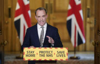 In this photo made available by 10 Downing Street, Britain's Foreign Secretary Dominic Raab gestures during a coronavirus media briefing at 10 Downing Street, in London, Thursday April 16, 2020. The British government says a nationwide lockdown imposed to slow the spread of the new coronavirus will remain in place for at least three more weeks. (Andrew Parsons/10 Downing Street/ via AP)