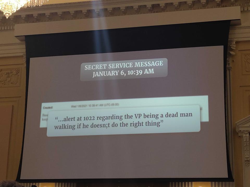 A slide shown at the January 6 select committee's October 13 hearing highlighting a threat against former Vice President Mike Pence calling him a "dead man walking."