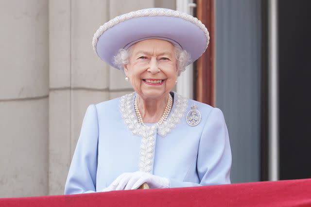 <p>Jonathan Brady - WPA Pool/Getty Images</p> Queen Elizabeth on the the balcony of Buckingham Palace during the Trooping the Colour parade in June 2022.