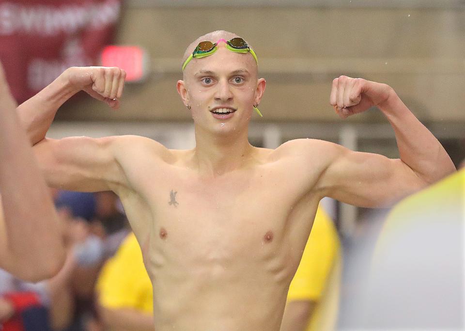 Firestone's Jonny Marshall celebrates his state championship in the 100-yard backstroke during the Division I state meet Saturday, Feb. 25, 2023 in Canton.