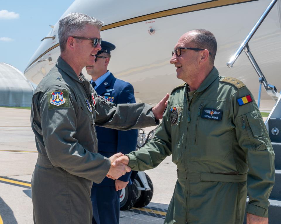 Alabama Air National Guard Chief of Staff, Brig. Gen. Ed Casey welcomes Chief of the Romanian Air Force Staff, Lt. Gen. Viorel Pană at the flight line, Dannelly Field, Alabama, June 29, 2023. The 187th Fighter Wing has hosted a State Partnership program with the Romanian Air Force since 1993. The two air forces fly F-16 missions together at Dannelly Field. The 187th is scheduled to transition from F-16s to F-35s, and the wing also provided an F-35 conversion tour for Pană the Romanian delegation.
