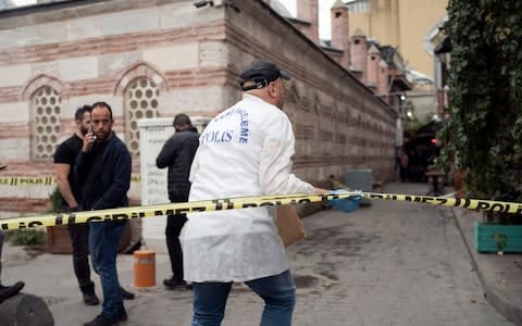 Police forensic officials at the scene in Istanbul - Credit: Emrah Gurel&nbsp;/AP