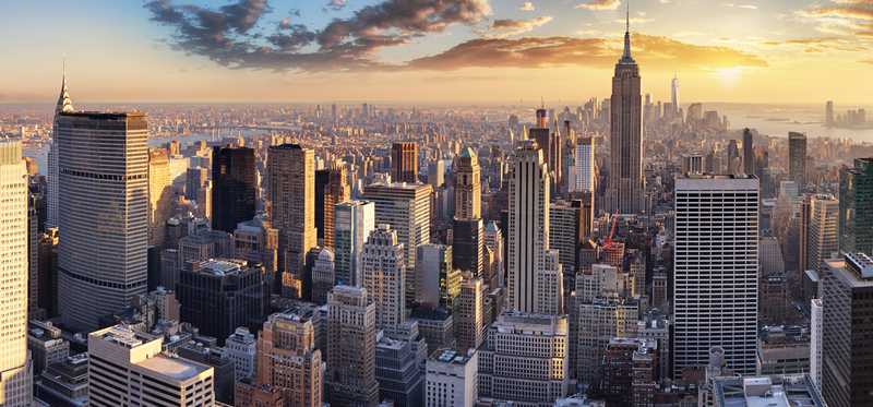 New York City skyline at sunrise.