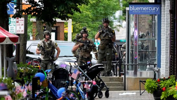 PHOTO: Law enforcement search after a deadly mass shooting at the Highland Park Fourth of July parade in downtown Highland Park, Ill., July 4, 2022. (Nam Y. Huh/AP)