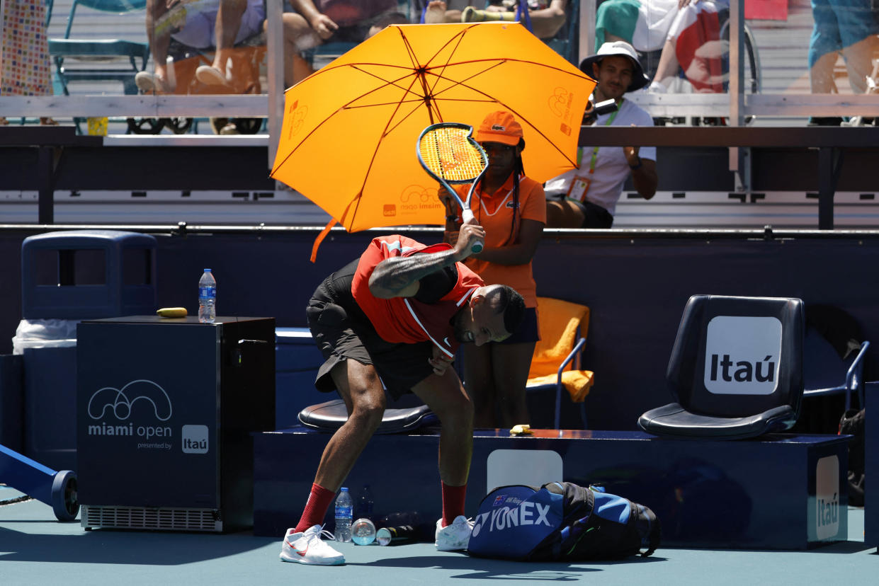 Mar 29, 2022; Miami Gardens, FL, USA; Nick Kyrgios (AUS) smashes his racquet at the end of the first set after being assessed a point penalty against Jannik Sinner (ITA)(not pictured) in a fourth round men's singles match in the Miami Open at Hard Rock Stadium. Mandatory Credit: Geoff Burke-USA TODAY Sports
