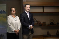 Parker J. Allen, right, and his mother and business partner Linda Allen pose for a photo before an interview with The Associated Press at Linda Allen's home in Ogawamachi, northwest of Tokyo, Friday, May 6, 2022. The Japanese yen has weakened, trading in recent weeks at 20-year lows of 130 yen to the U.S. dollar just when prices of oil and other goods are surging due to the war in Ukraine, and that's a mixed blessing. The news on the weakening yen hasn’t been all bad for some including Allen. Interest is picking up, said Allen, who runs a business finding bargain-priced homes in the Japanese countryside and suburban Tokyo for foreign buyers looking for a second home or office. (AP Photo/Hiro Komae)