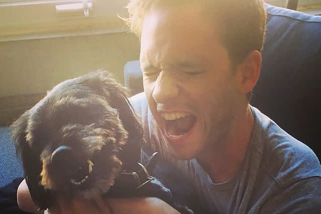 <p>Patrick J. Adams/Instagram</p> Patrick J. Adams posts a photo of himself with his dog Charlie as he announces the sad death of his pet on Instagram Friday