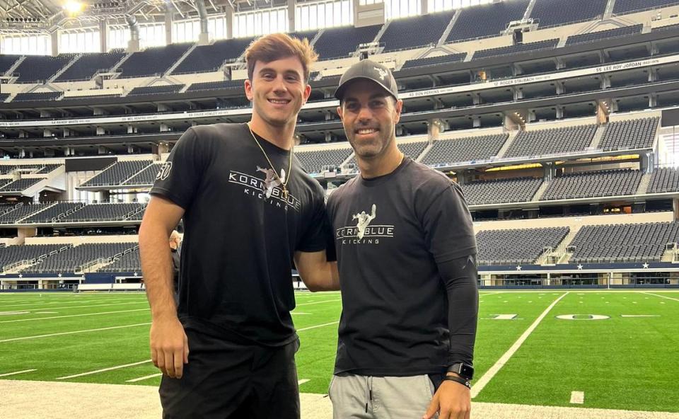 Daniel Lester poses with Brandon Kornblue during a camp at AT&T Stadium in Arlington, Texas.