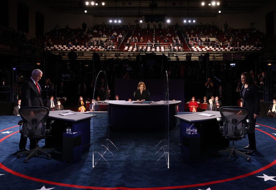 SALT LAKE CITY, UTAH - OCTOBER 07: Democratic vice presidential nominee Sen. Kamala Harris (D-CA) and U.S. Vice President Mike Pence take the stage in the vice presidential debate at the University of Utah on October 7, 2020 in Salt Lake City, Utah. The vice presidential candidates only meet once to debate before the general election on November 3. (Photo by Justin Sullivan/Getty Images)