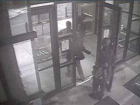 Aaron Alexis enters Building #197 at 8:08 a.m., carrying a backpack, in this undated handout photo released by the FBI. Over the course of an hour-long shooting incident at the Washington Navy Yard in Washington, DC on September 16, 2013, Aaron Alexis killed 12 people and wounded four others before he was shot and killed by law enforcement officers. REUTERS/FBI/Handout via Reuters