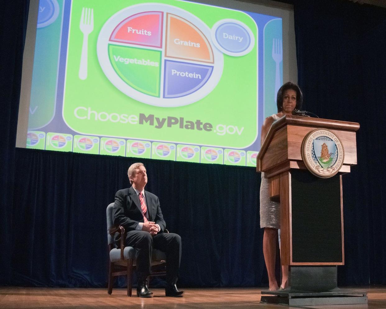 first lady michelle obama, agriculture secretary tom vilsack and surgeon general regina benjamin unveiled the new food icon myplate that will serve as a reminder to help consumers make healthier food choices at the united states department of agriculture,