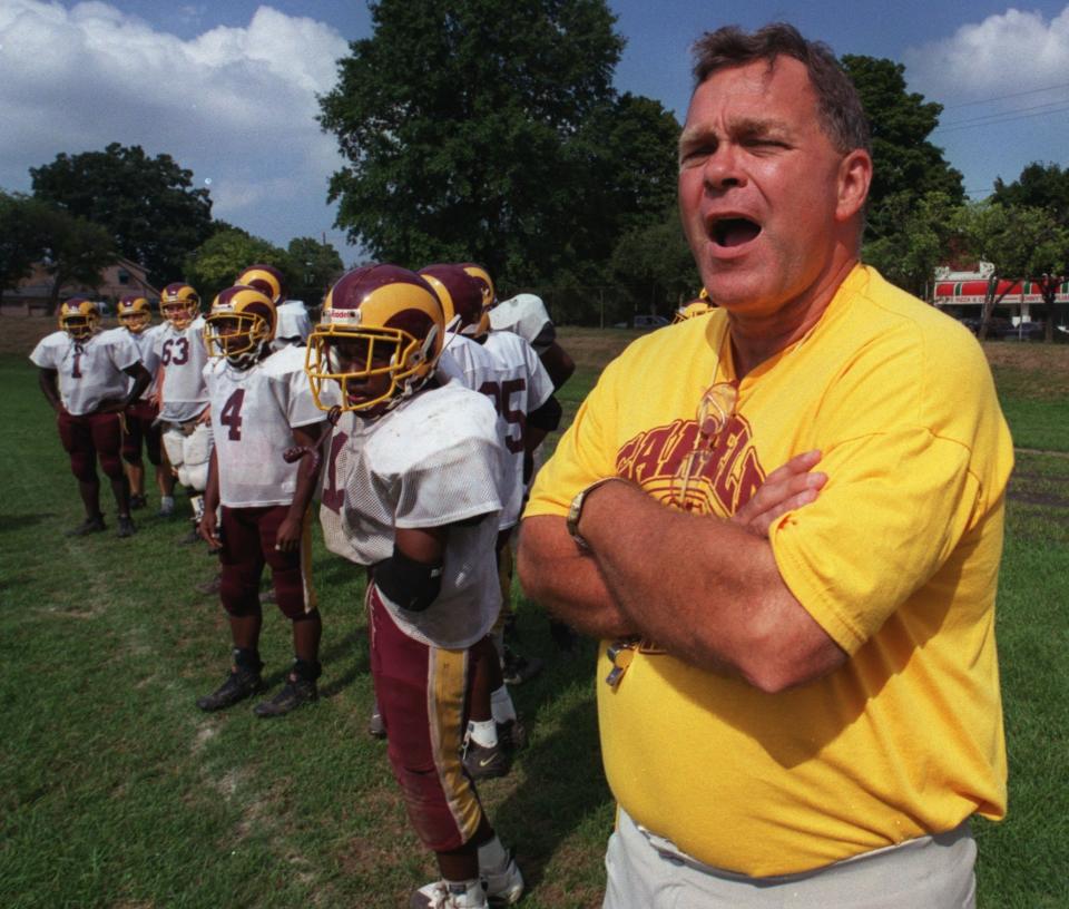 Garfield coach Bill McGee shouts instructions to his players during practice on Aug. 28, 2001.