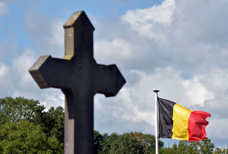 A Belgian flag waves at the cemetery where the Belgian mayor Alfred Gadenne was found dead in Mouscron, Belgium September 12, 2017. REUTERS/Eric Vidal