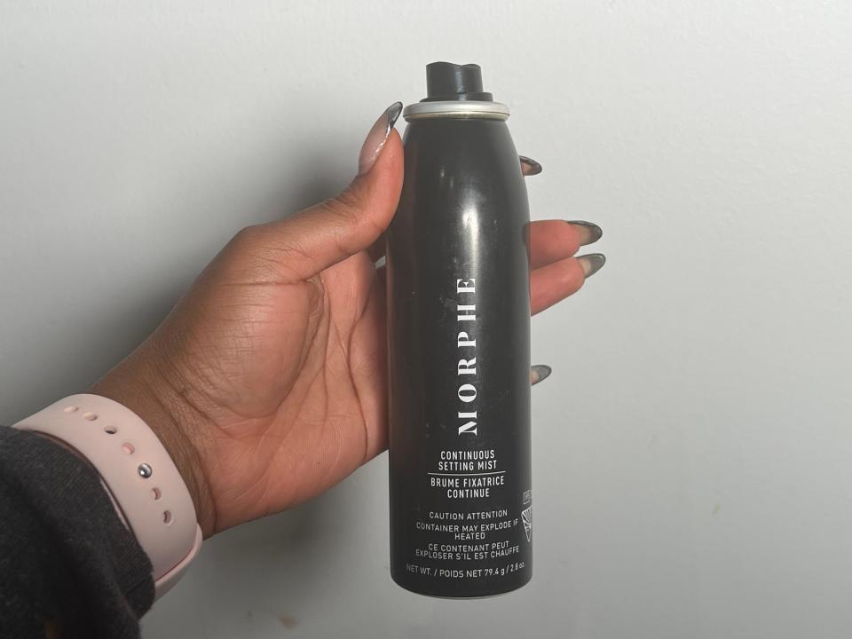 The writer holds the Morphe continuous setting mist