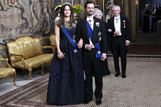 <p>Fredrik Sandberg/TT/Shutterstock</p> Princess Sofia and Prince Carl Philip at the state banquet at Stockholm Palace on April 23, 2024.