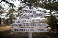 A directional sign post is seen at the Neutral Nations Supervisory Commissions (NNSC) headquarters near the truce village of Panmunjom, South Korea, March 30, 2016. REUTERS/Kim Hong-Ji/Files